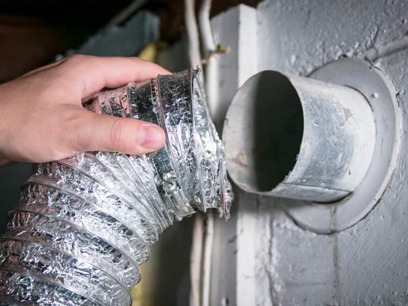 professional holding dryer vent hose